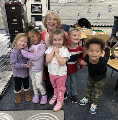 Mrs. Bryant and preschool students in a classroom